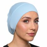 Flat lay of baby-blue premium soft stretch knitted cotton under scarf cap by SCARF 'N' SHAWLS measuring 24.5 cm x 22 cm