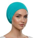 Flat lay of cyan premium soft stretch knitted cotton under scarf cap by SCARF 'N' SHAWLS measuring 24.5 cm x 22 cm