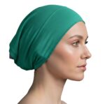 Flat lay of dark-green premium soft stretch knitted cotton under scarf cap by SCARF 'N' SHAWLS measuring 24.5 cm x 22 cm