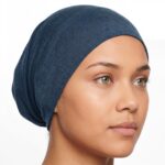 Flat lay of dresden-blue premium soft stretch knitted cotton under scarf cap by SCARF 'N' SHAWLS measuring 24.5 cm x 22 cm