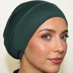 Flat lay of khaki premium soft stretch knitted cotton under scarf cap by SCARF 'N' SHAWLS measuring 24.5 cm x 22 cm