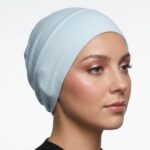 Flat lay of lilac-mist premium soft stretch knitted cotton under scarf cap by SCARF 'N' SHAWLS measuring 24.5 cm x 22 cm