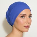 Flat lay of navy premium soft stretch knitted cotton under scarf cap by SCARF 'N' SHAWLS measuring 24.5 cm x 22 cm
