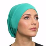 Flat lay of parrot-green premium soft stretch knitted cotton under scarf cap by SCARF 'N' SHAWLS measuring 24.5 cm x 22 cm