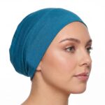 Flat lay of royal premium soft stretch knitted cotton under scarf cap by SCARF 'N' SHAWLS measuring 24.5 cm x 22 cm