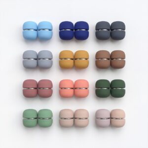 A set of four oval solid-colour safety pin buckles for hijab and scarf styling, featuring a hidden pin design