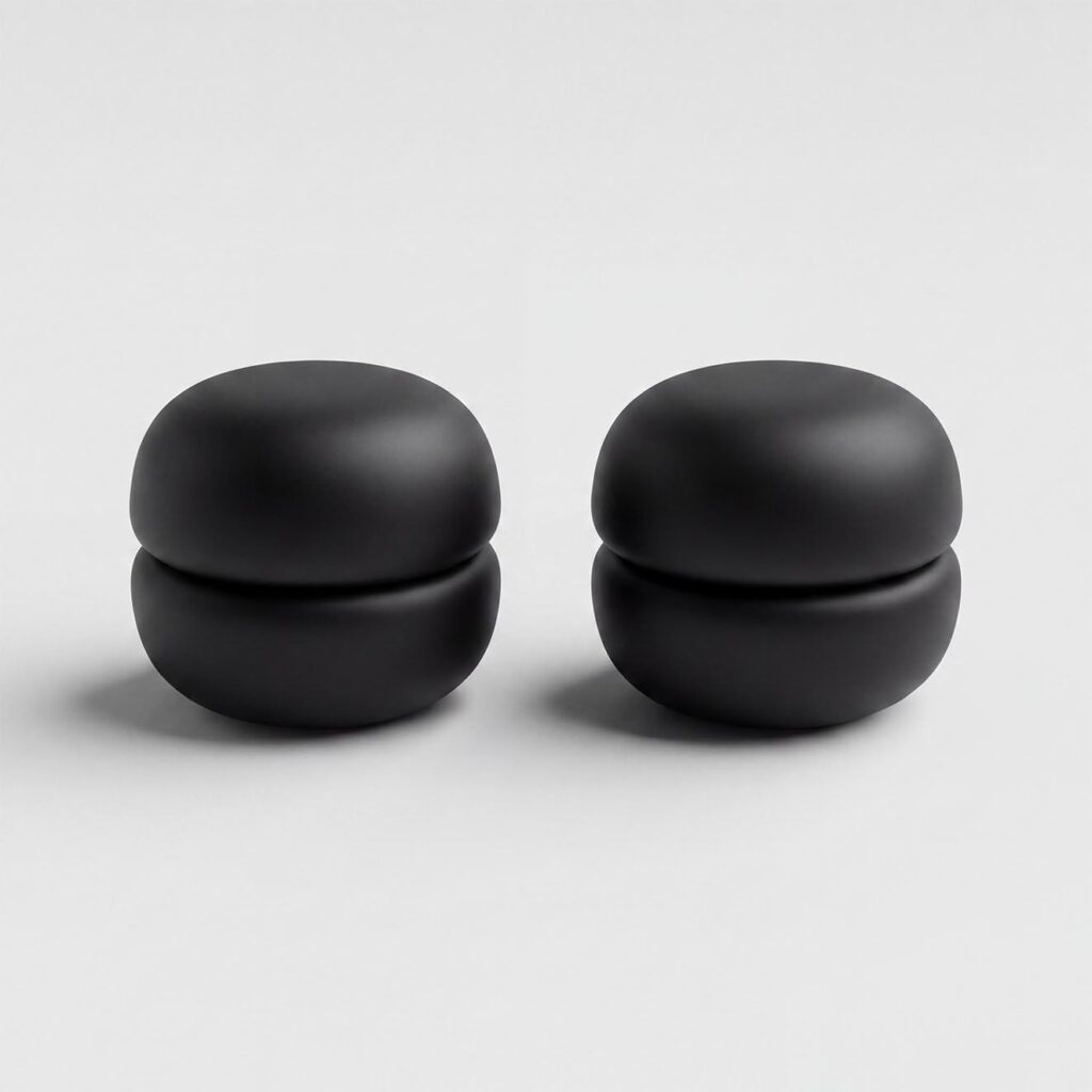 Pair of strong magnetic hijab pins in black with a smooth matte finish, designed for snag-free scarf styling.