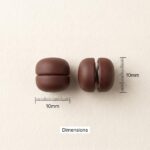 Pair of strong magnetic hijab pins in mocha-brown with a smooth matte finish, designed for snag-free scarf styling.