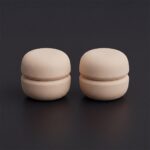 Pair of strong magnetic hijab pins in nude-ecru with a smooth matte finish, designed for snag-free scarf styling.