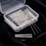 A clear plastic storage box containing fine, silver-toned headless straight pins designed for scarves and turbans, displayed against a black background.
