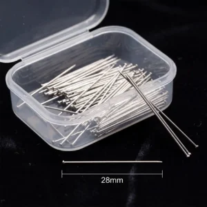 A clear plastic storage box containing fine, silver-toned headless straight pins designed for scarves and turbans, displayed against a black background