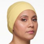 Flat lay of chamois premium soft stretch knitted cotton under scarf cap by SCARF 'N' SHAWLS measuring 24.5 cm x 22 cm