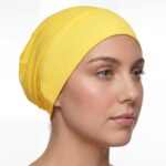 Flat lay of goldenrod premium soft stretch knitted cotton under scarf cap by SCARF 'N' SHAWLS measuring 24.5 cm x 22 cm