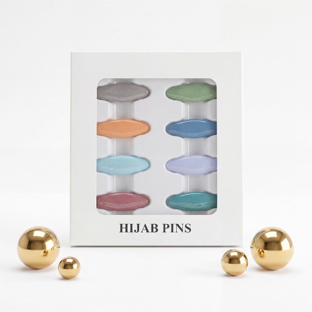 Pack of 8 snag-free hijab safety clips in [Colour Name] displayed in a white window box for scarf and clothing decoration.