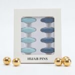 Pack of 8 snag-free hijab safety clips in [Colour Name] displayed in a white window box for scarf and clothing decoration.