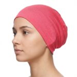 Flat lay of Raspberry premium soft stretch knitted cotton under scarf cap by SCARF 'N' SHAWLS measuring 24.5 cm x 22 cm