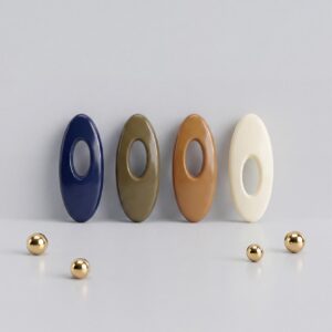 A set of four oval solid-colour safety pin buckles for hijab and scarf styling, featuring a hidden pin design in Earthy Tones