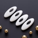 A set of four oval solid-colour safety pin buckles for hijab and scarf styling, featuring a hidden pin design in Pure Pearl