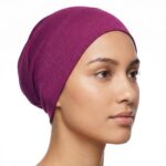 Flat lay of burgundy premium soft stretch knitted cotton under scarf cap by SCARF 'N' SHAWLS measuring 24.5 cm x 22 cm
