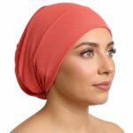 Flat lay of chilly-red premium soft stretch knitted cotton under scarf cap by SCARF 'N' SHAWLS measuring 24.5 cm x 22 cm