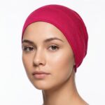 Flat lay of popy-red premium soft stretch knitted cotton under scarf cap by SCARF 'N' SHAWLS measuring 24.5 cm x 22 cm