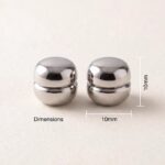 Pair of strong magnetic hijab pins in silver with a smooth matte finish, designed for snag-free scarf styling.