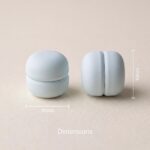 Pair of strong magnetic hijab pins in white with a smooth matte finish, designed for snag-free scarf styling.