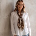 Women's 70x70cm 100% polyester square scarf featuring vibrant prints including floral, styled as a neck accessory or laid flat.