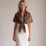 Women's 70x70cm 100% polyester square scarf featuring vibrant prints including floral, styled as a neck accessory or laid flat.